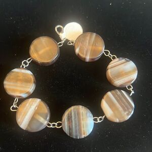 Handcrafted Brown and white bead silver tone bracelet.
